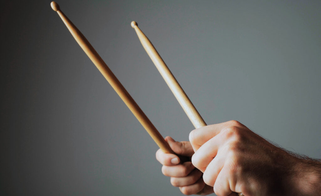 hold drumsticks